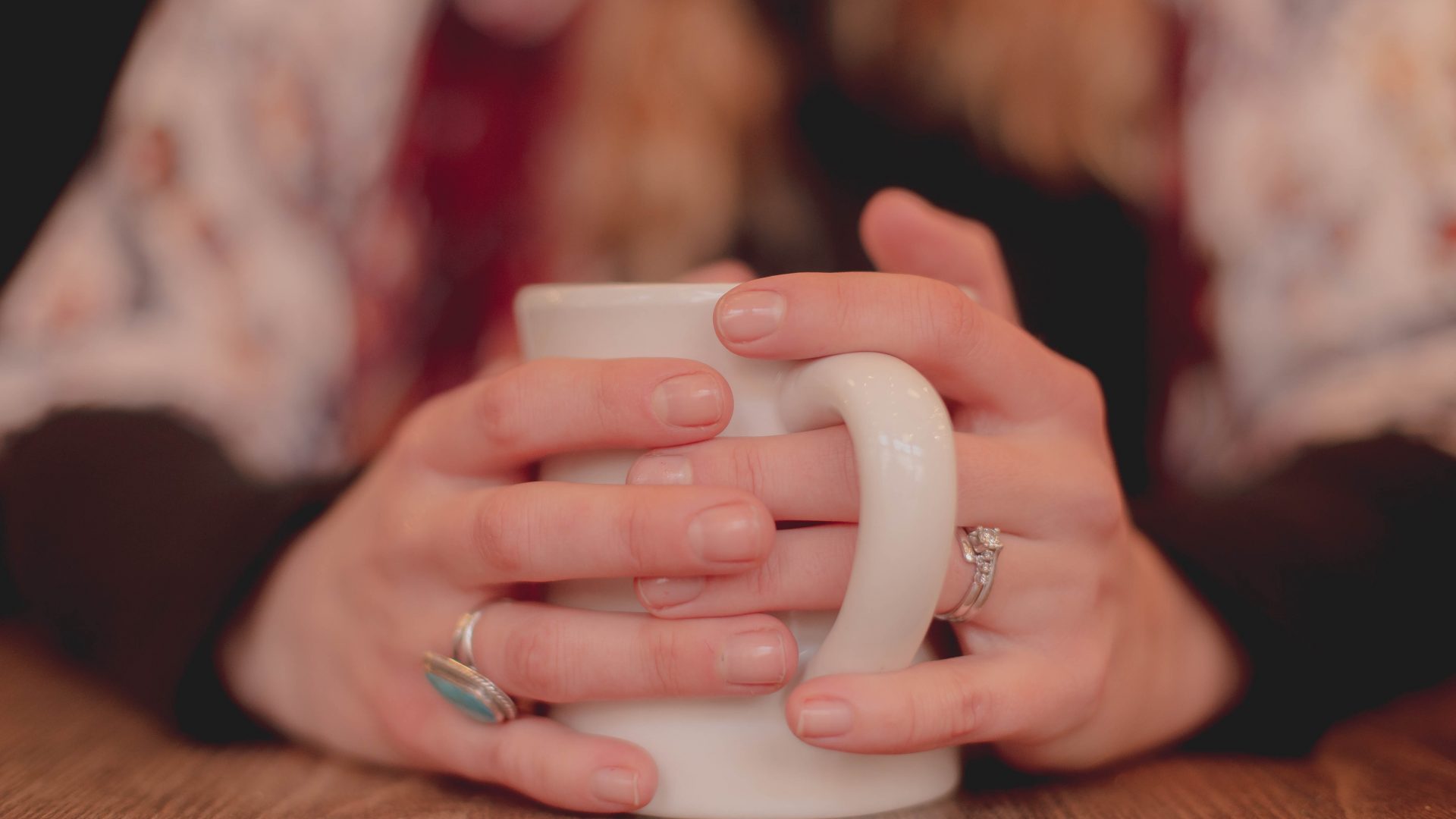 A person is holding a mug