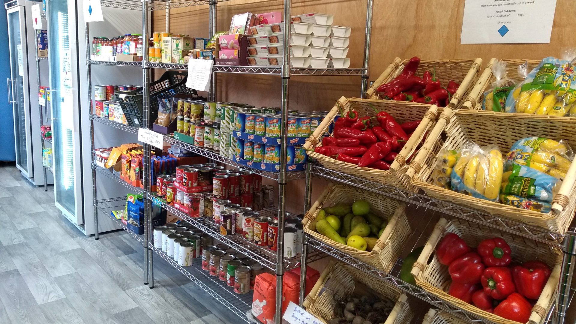 fruit, vegetables, cans and freezers in a shop